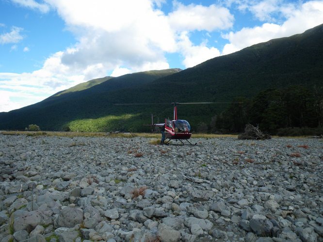 A helicopter on a river bed in New Zealand